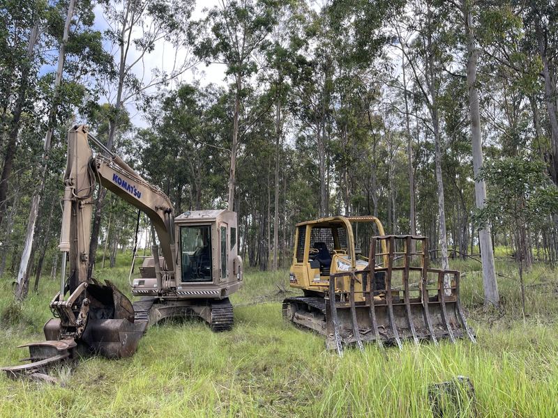 Komatsu PC130 excavator and Caterpillar D3G dozer on a rural job site near Tabulam, NSW